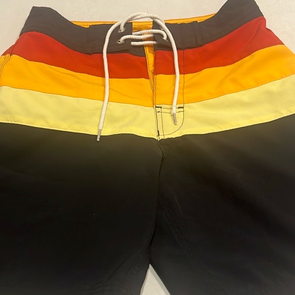Green lines board short size 26. Great for teenage boys